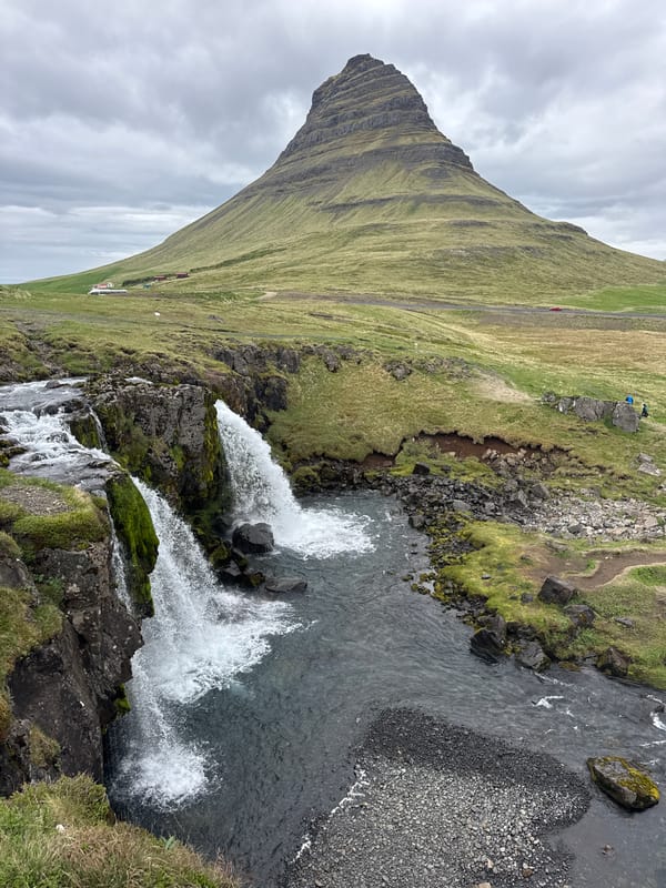 Visitors document iconic Kirkjufell mountain and waterfalls in Iceland