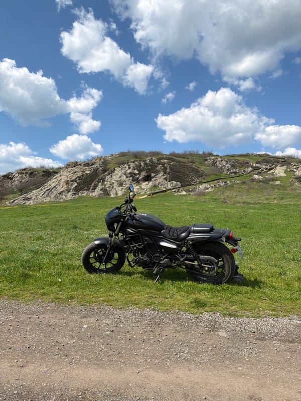 Motorcycle and hillside landscape documented in rural Bulgaria