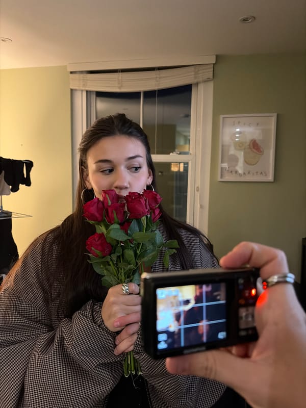 Woman poses with red roses during London photo session