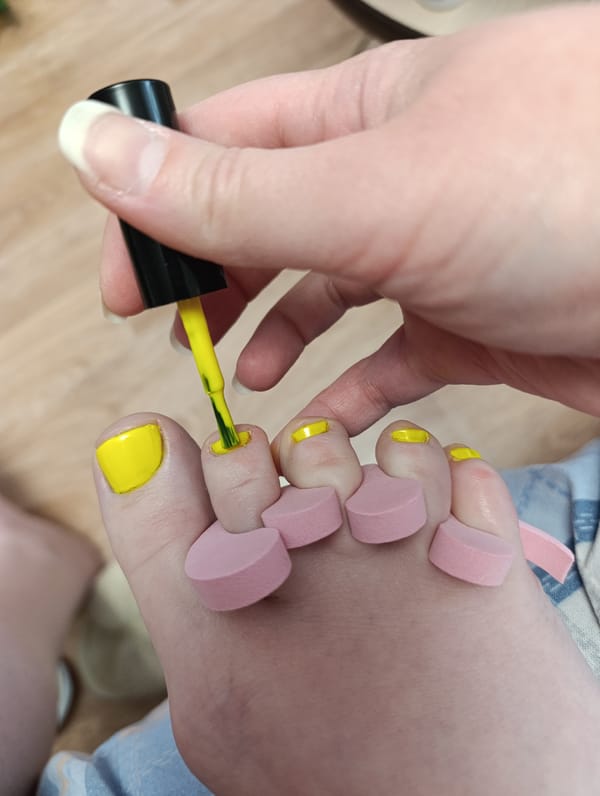 Home nail care session documented with cat observer