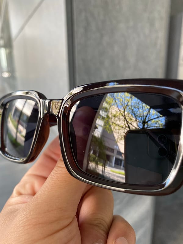 Person photographed with reflective sunglasses in Lucerne, Switzerland