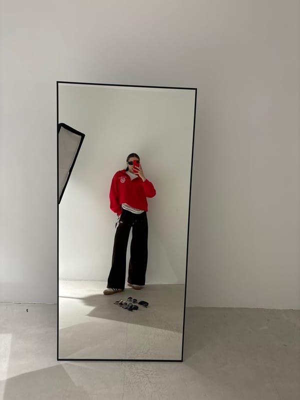 Woman conducts mirror selfie photo session in Krasnodar studio