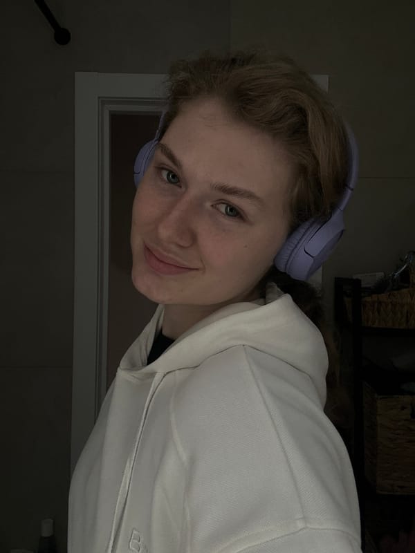 Woman in headphones photographed indoors in Kazan