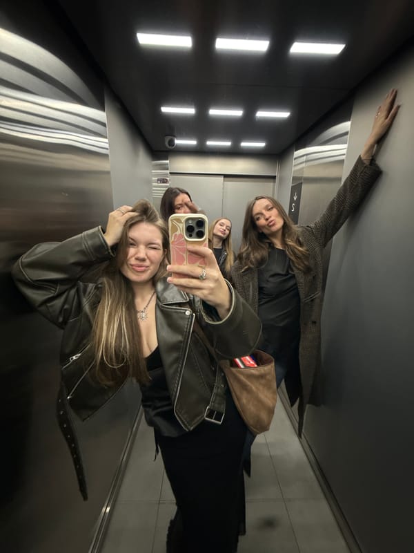 Woman enjoys music lying on rug in Belgrade apartment