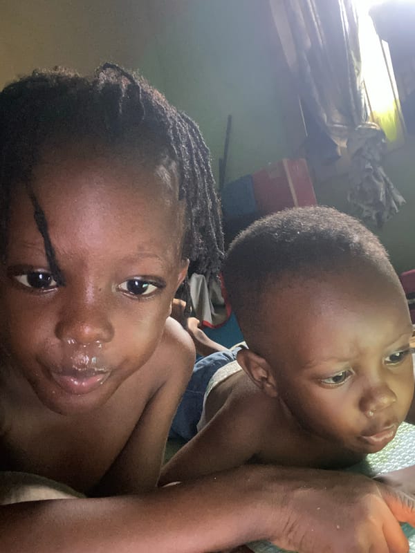 Child and adult photographed in intimate reclining moments