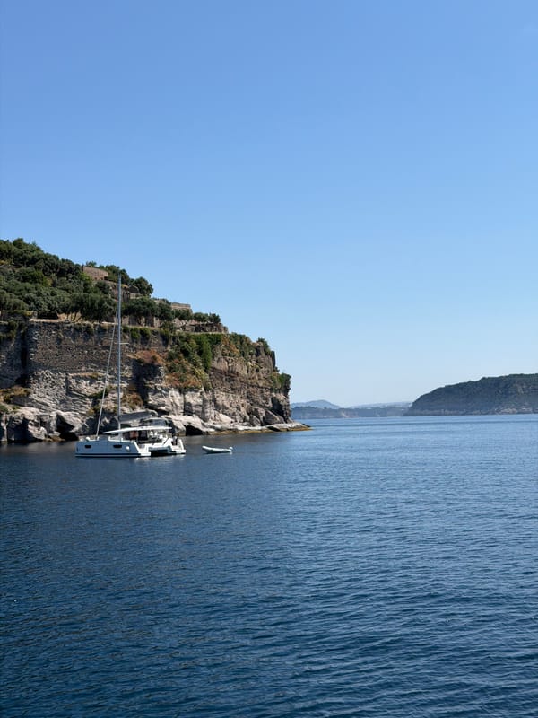 Boat tour captures scenic Ischia coastline and Aragonese Castle
