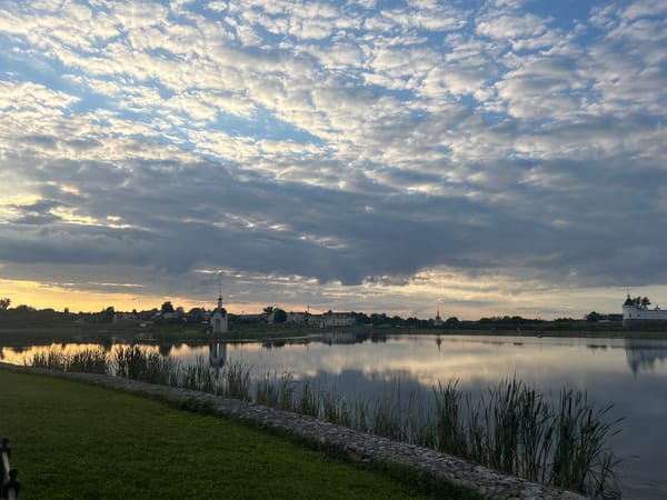Calm waterfront views of Diveyevo Monastery at golden hour