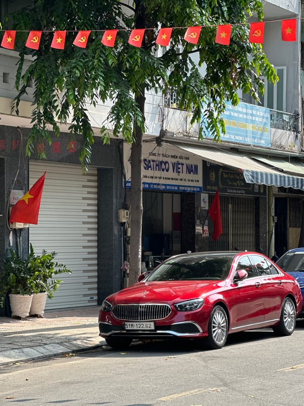Street scene captured in Ho Chi Minh City with flags