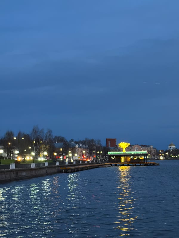 Family enjoys evening waterfront stroll in Votkinsk, Russia