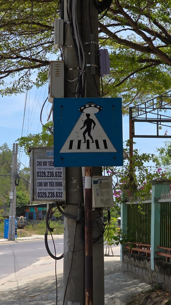 Unusual UFO-themed pedestrian crossing sign spotted in Nha Trang