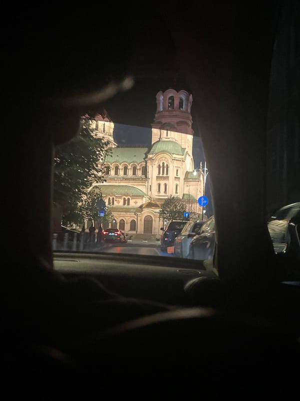Nighttime drive past illuminated St. Alexander Nevsky Cathedral, Sofia