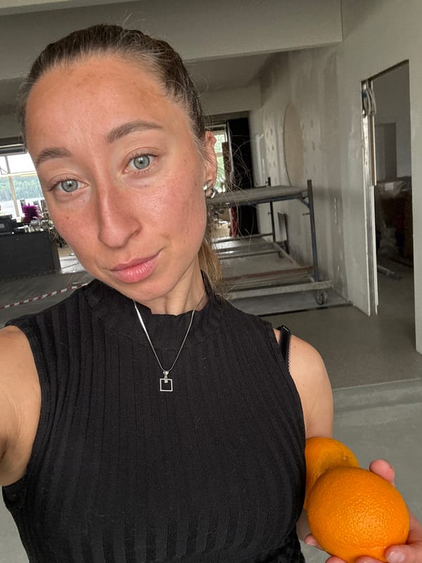 Woman photographed juggling and posing with oranges in Chaikovsky