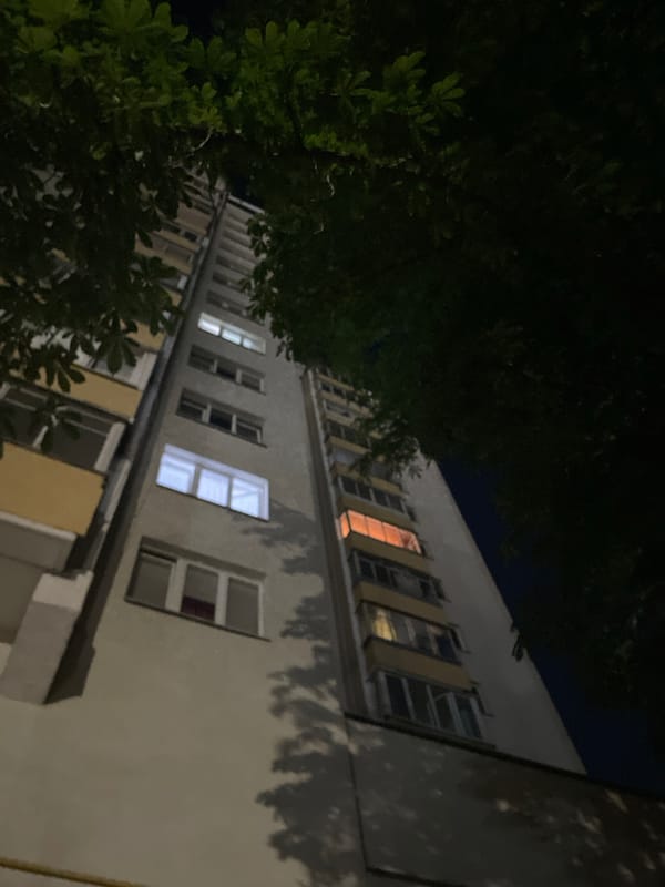 Late-night walk around an illuminated stadium and its surroundings