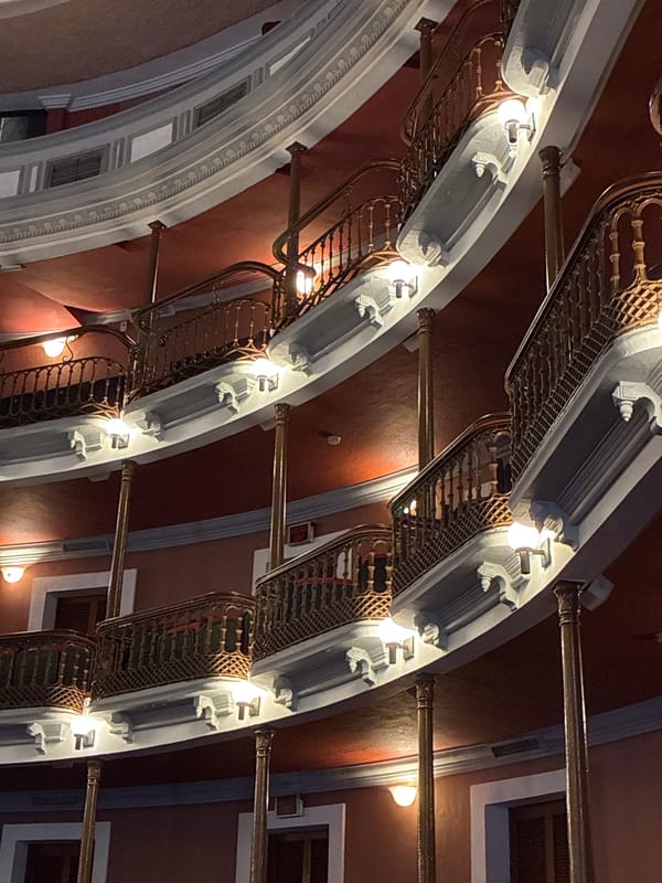 Visitor documents historic architecture during afternoon walk in Mazatlán