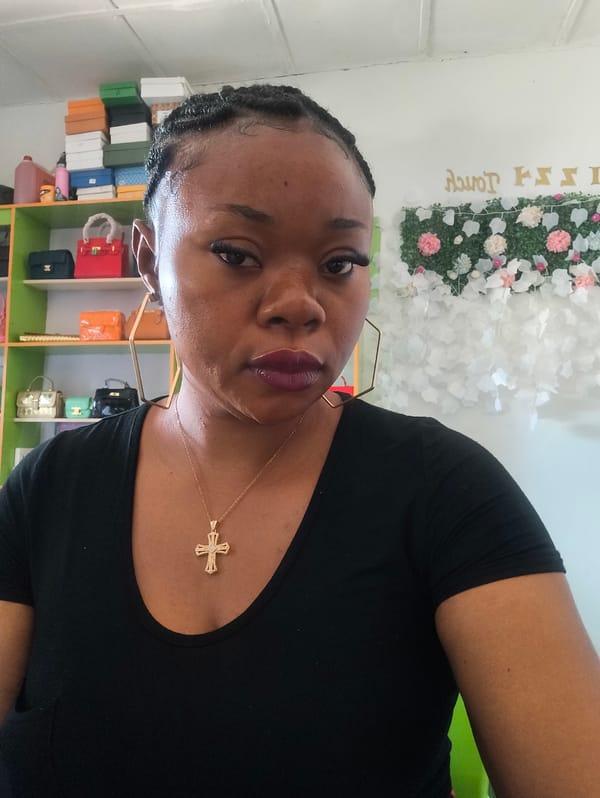 Woman takes selfie in boutique, Kabong Nigeria