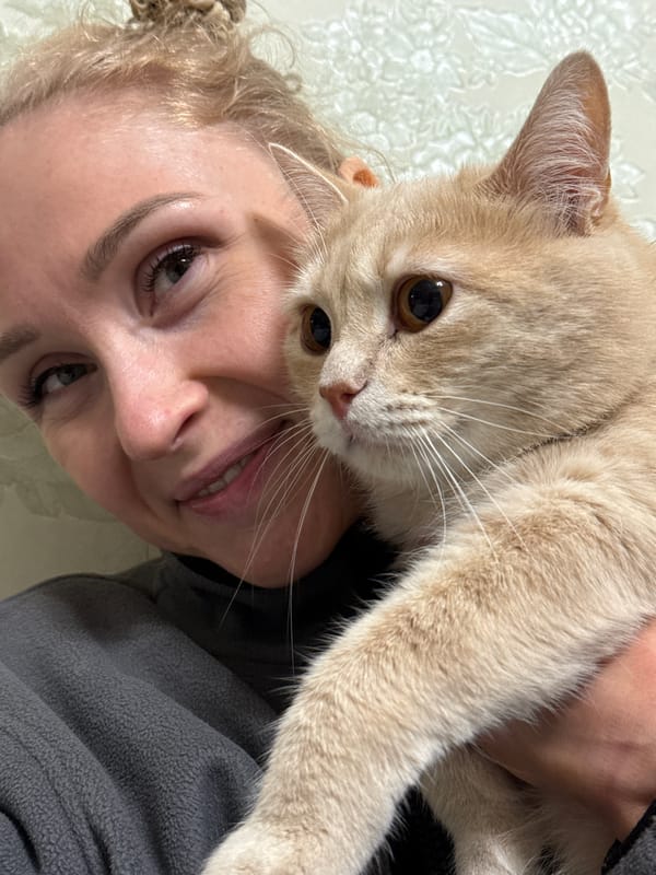 Woman takes selfie with brown cat in Perm