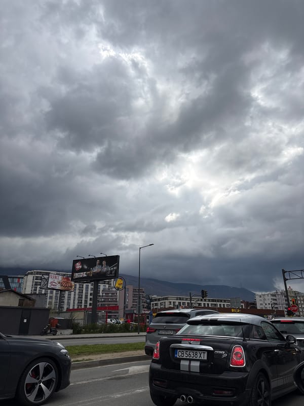 Regular traffic and parked vehicles observed in Sofia