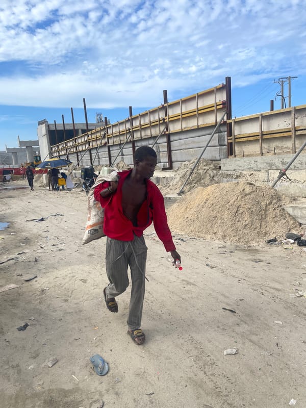 Daily life unfolds amid construction and flooding in Ilado