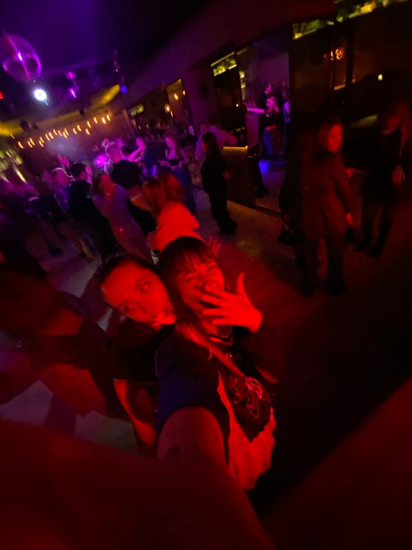 Nightclub scene captured by witnesses in atmospheric lighting