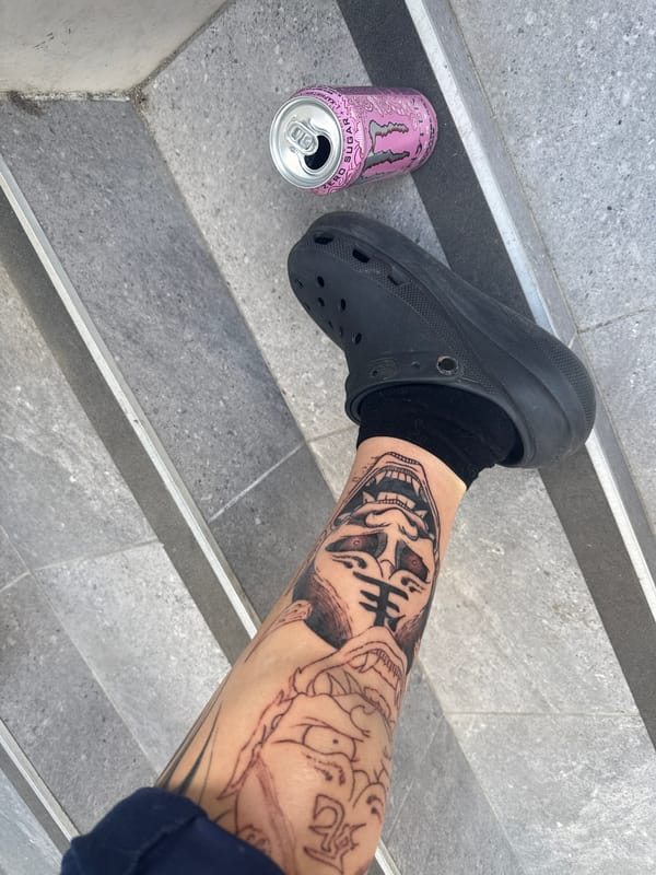 Woman takes selfie, cat rests among clothes in Burgas