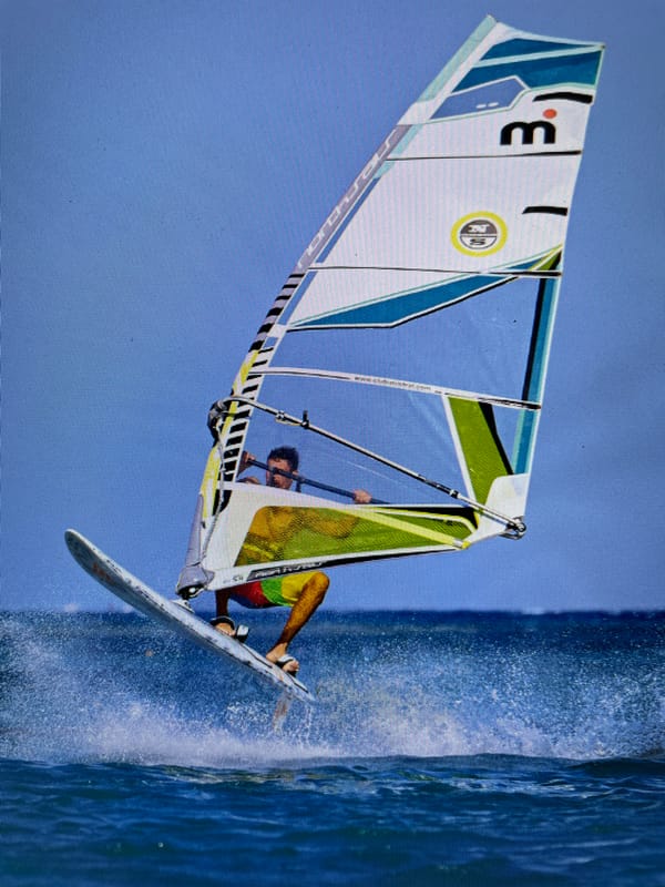 Windsurfer and kiteboarder active off Bacong Philippines coast