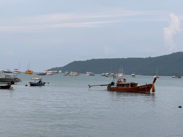 Chalong Bay marina and waterfront dining on a cloudy morning
