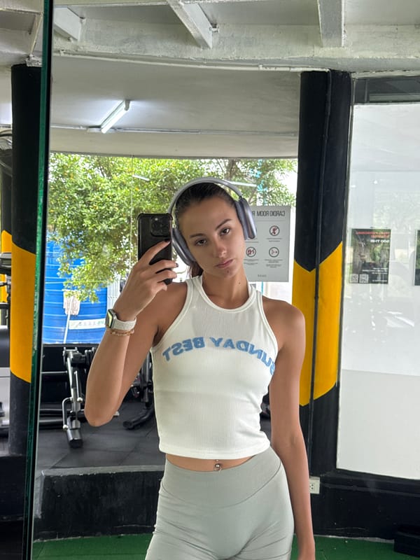 Woman takes gym selfies in Kathu, Thailand early morning