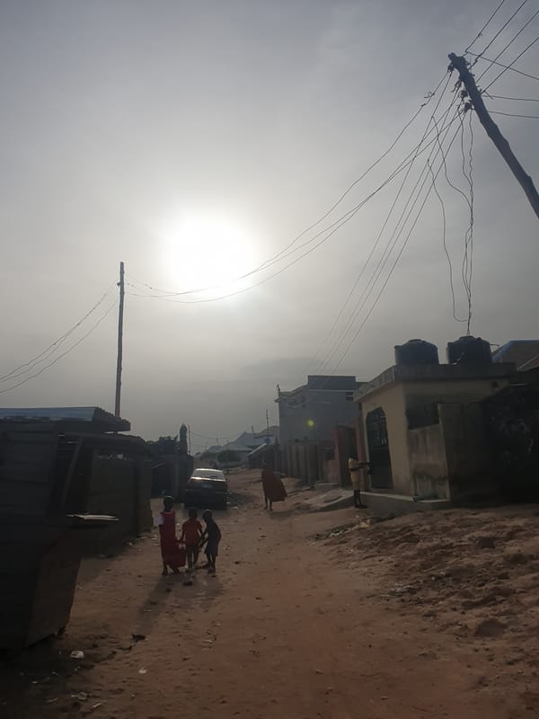 Women and children gather in residential courtyard, Lokoja Nigeria