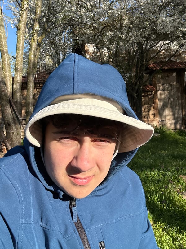 Person takes outdoor tech break in Bulgarian town park