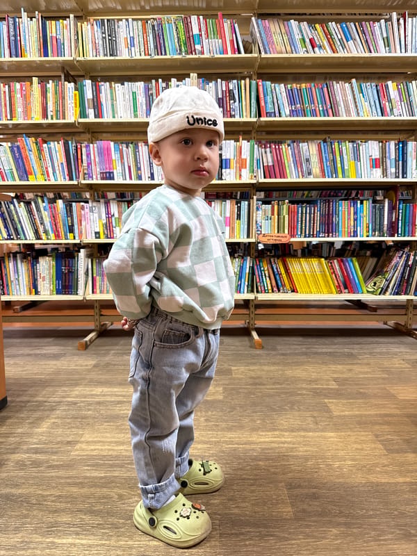 Woman and child share quiet moment in Rusanovo bookstore
