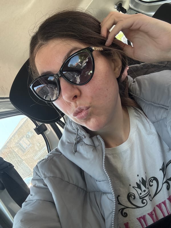 Woman observed in vehicle wearing casual winter attire