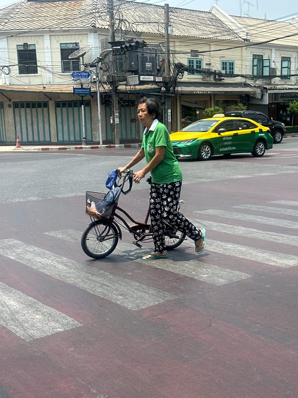 Morning street life documented in central Bangkok neighborhood