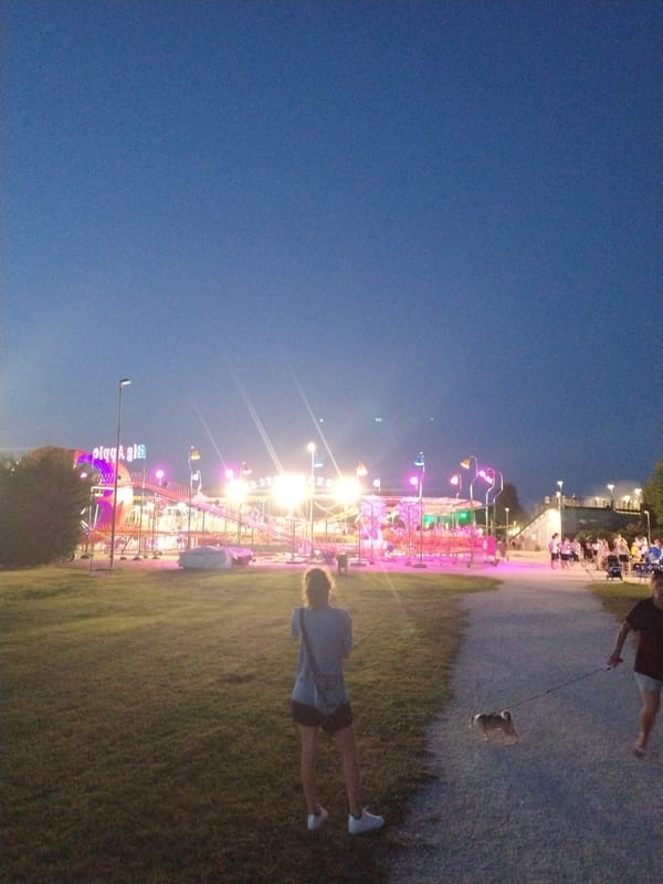 Summer fair night in Caorle: rides, moths, and a live show
