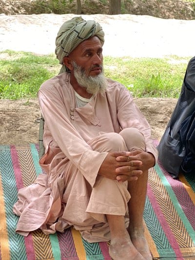 Afghan men gather for UNODC event in Mansurabad