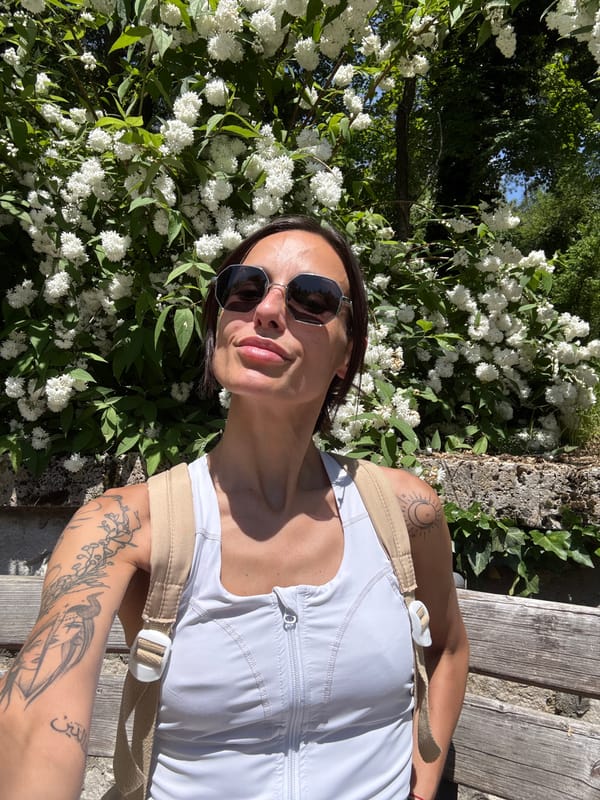 Woman poses among spring flowers in Pleven park