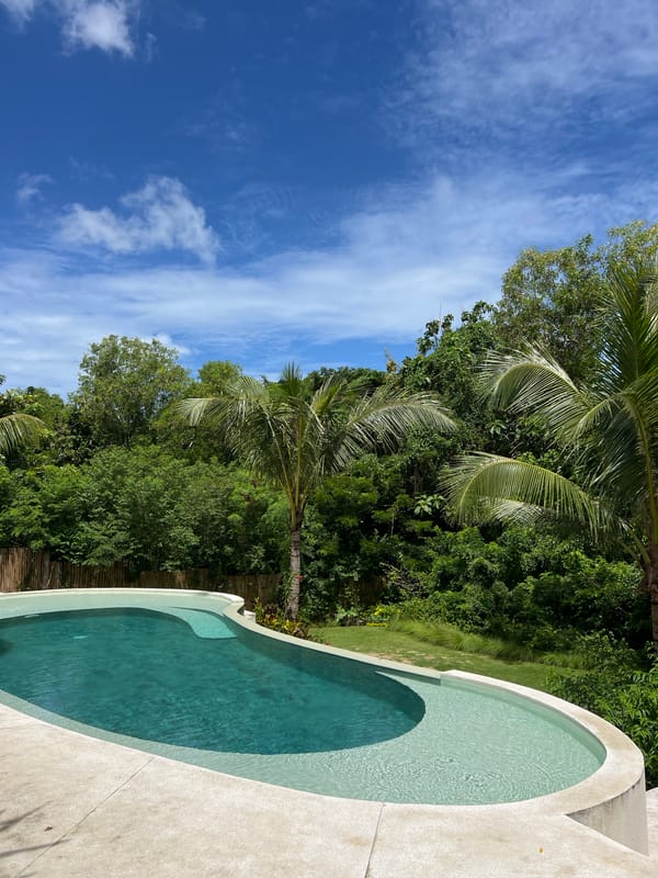 Morning poolside coconut drinks captured at Kuta Selatan resort