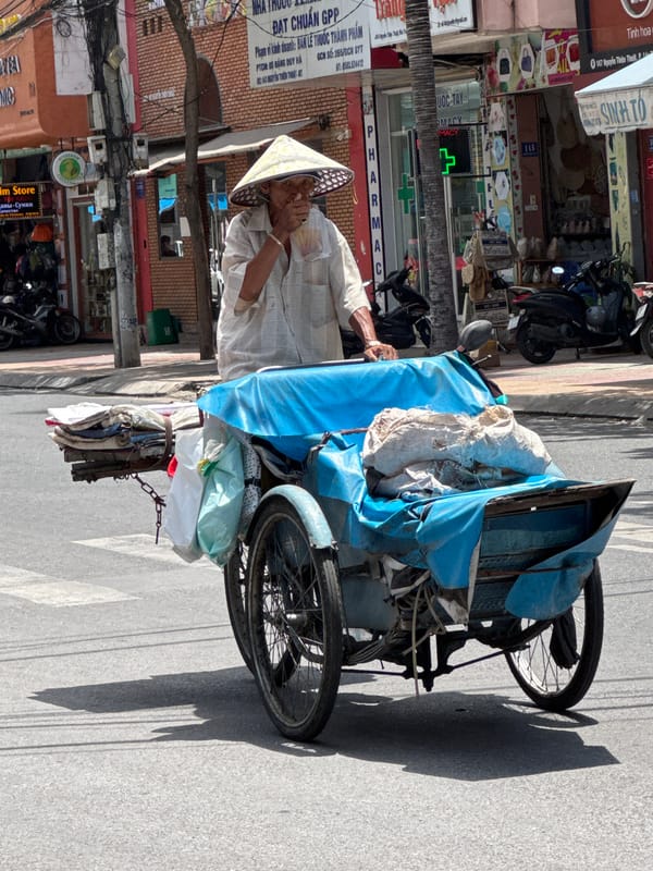 Everyday street life and vendors moving through Nha Trang