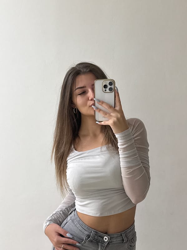 Woman takes selfies with dog in Sofia indoor setting