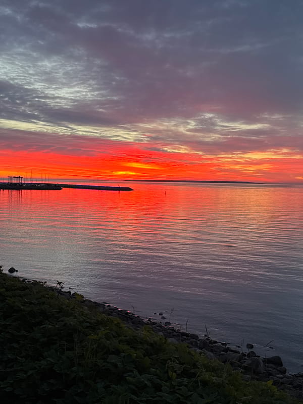 Dramatic sunset captivates Tallinn harbor visitors on summer evening