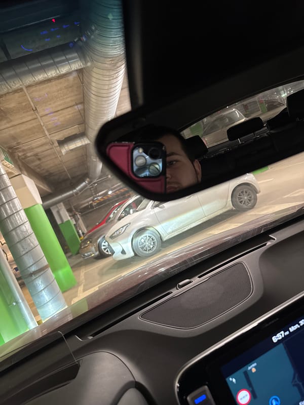 Driver captures reflection in car mirror at Vantaa parking garage