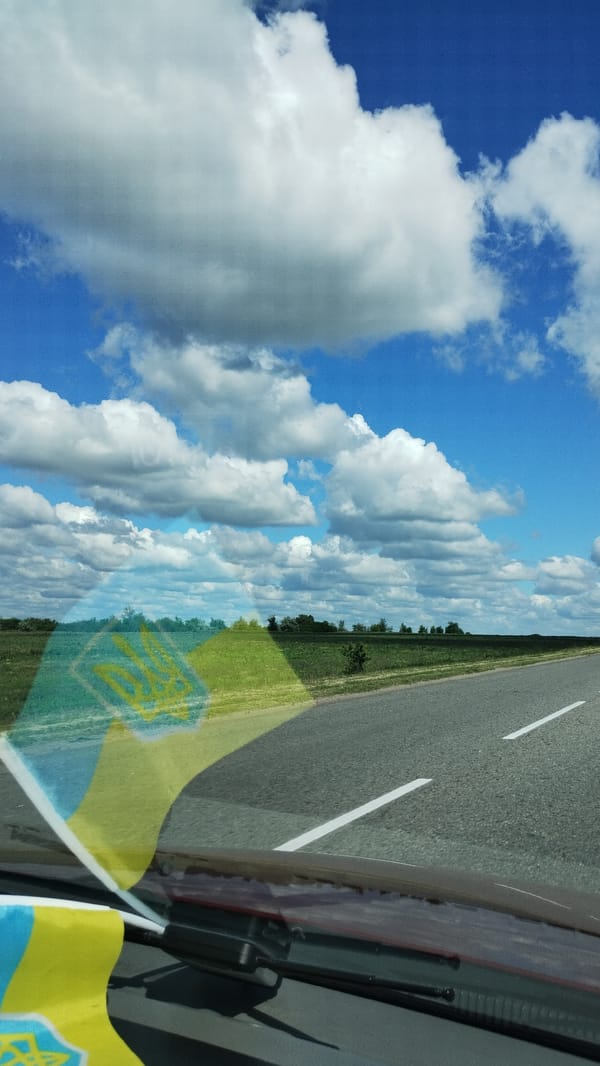 Morning drive through Kropyvnytskyi under cloudy blue skies