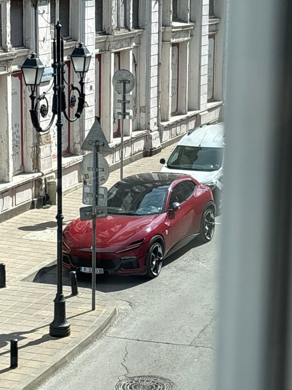 Red Ferrari spotted parked on street in Ruse, Bulgaria