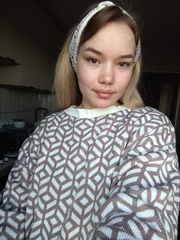 Portrait of young woman photographed in kitchen in Марковский
