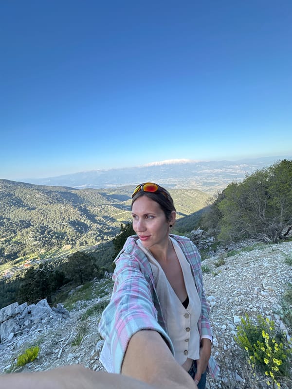 Tourist takes selfies on cliffs near Fethiye, Turkey