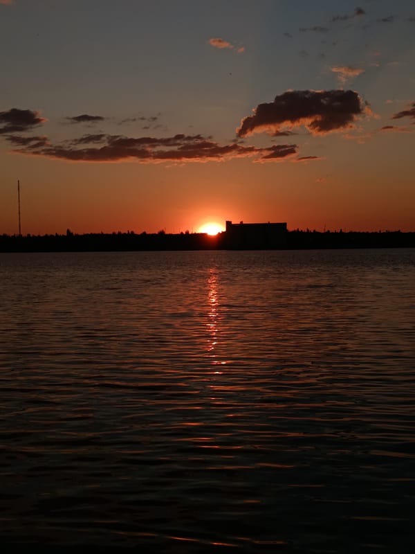 Live music and a waterfront sunset on a summer evening
