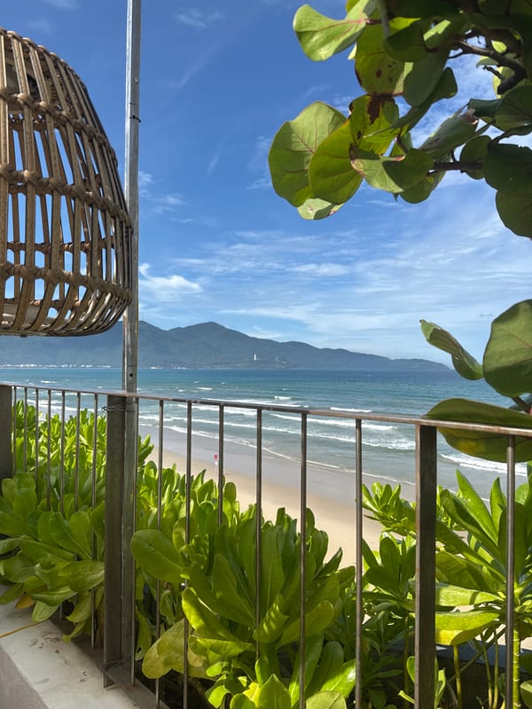 Woman relaxes at beachfront patio in Đà Nẵng, Vietnam