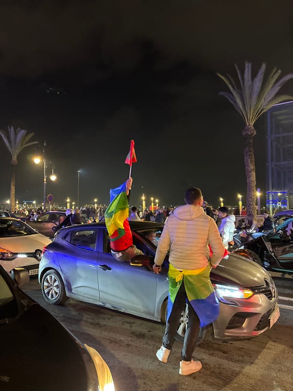 Tangier crowds celebrate with flags, flares in nighttime victory
