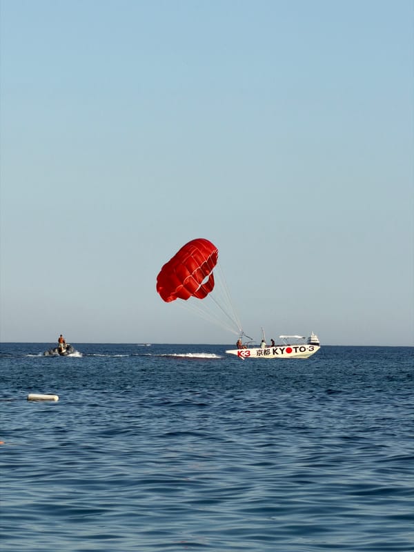 White boat on blue Adriatic water near Budva