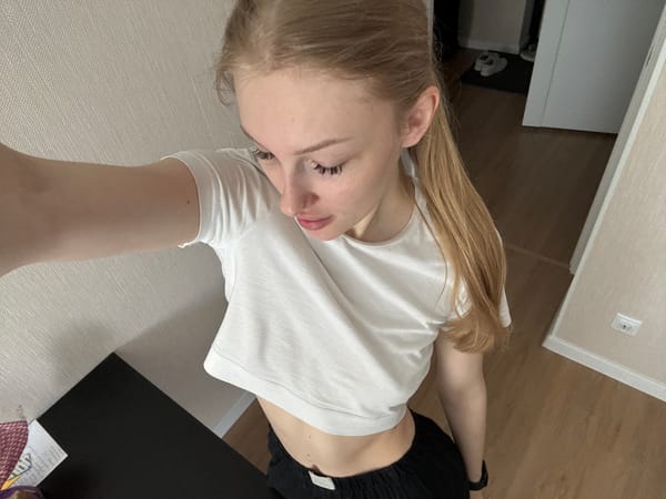 Woman documents breakfast selfie and toast preparation in Perm
