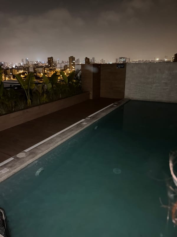 Rooftop gathering in Miraflores under crescent moon early morning